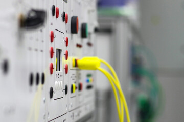 Electrical equipment and appliances, front panel with wires, connectors and switches.
