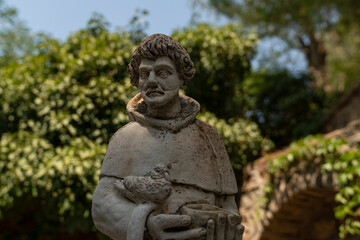 Fototapeta na wymiar Saint Statue In The Garden Of Virgin Mary House