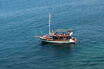 Kusadasi, Aydin, Turkey - August 23, 2021:Boat carrying scuba divers for touristic purposes.