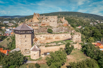 Fototapeta na wymiar Aerial view of partially restored medieval Filakovo Fulek castle in Southern Slovakia with cannon bastion