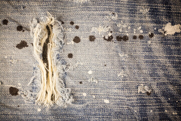 Torn denim dirty jeans texture - obrazy, fototapety, plakaty