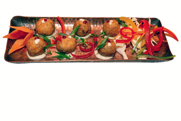 chicken balls on a plate isolated on white with copy space.