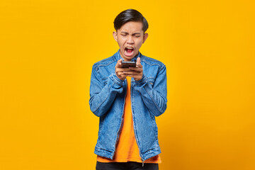 portrait of asian man angry when talk at smartphone