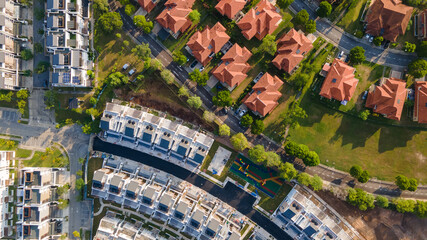 An aerial top down view of luxury residential neighbourhood during sunrise