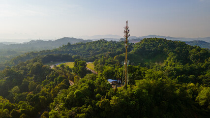 Obraz premium Aerial view of 5G Communication tower during beautiful sunrise with clouds