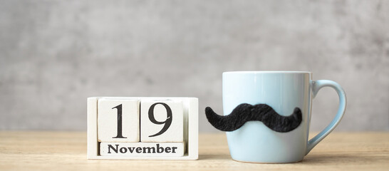 International Men day with November 19 calendar, Blue coffee cup or tea mug and Black mustache...