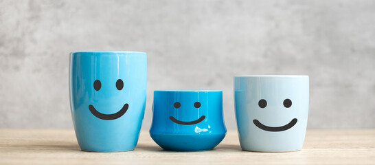 World smile day and International coffee day concept. happy face of blue coffee cup for customer...