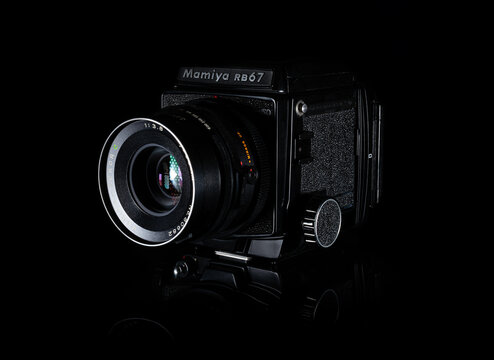 Fukuoka, Japan - october 10, 2021 : Mamiya RB67 pro SD professional medium format single-lens reflex film camera released in 1990 isolated on black background 