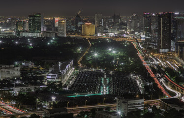 Fototapeta premium Bangkok, thailand - Aug 28, 2020 : Aerial view of Bang Sue central station with skyscrapers background at night. Selective focus.