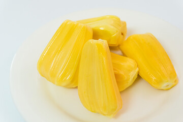 Ripe jack fruits isolated on white background. Fresh Jackfruit or Kathal in white plate, cutting jackfruit