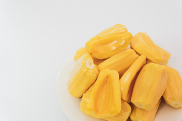 Ripe jack fruits isolated on white background. Fresh Jackfruit or Kathal in white plate, cutting jackfruit