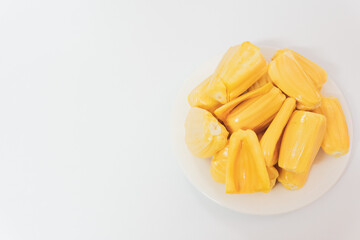 Ripe jack fruits isolated on white background. Fresh Jackfruit or Kathal in white plate, cutting jackfruit