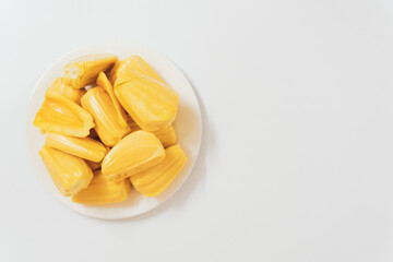 Ripe jack fruits isolated on white background. Fresh Jackfruit or Kathal in white plate, cutting jackfruit