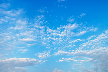 Naklejka na ściany i meble blue sky with white spindrift clouds on day