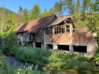 Remains of an old sawmill on the small dam of Čogrljevo Lake in the mountain hamlet of Tići - Gorski kotar, Croatia (Ostaci stare pilane na maloj brani Čogrljevog jezera u goranskom zaselku Tići)