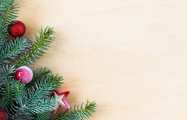 Fototapeta na wymiar Christmas fir tree with decoration on a wooden board. Copy space