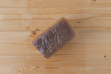 A piece of rye bread. Food products.