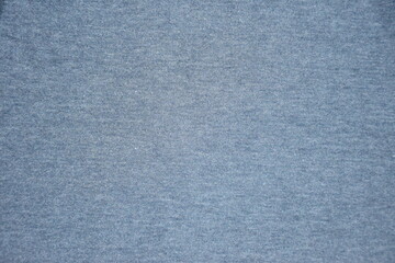 The background or texture of the fabric is bluish gray.
