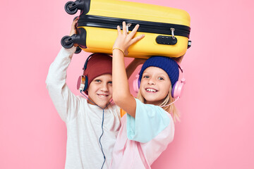 adorable little kids stylish clothes suitcase headphones isolated background