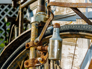 Details of a rusty old bike in a garden