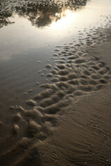 Sand wave pattern on the beach, abstract nature background