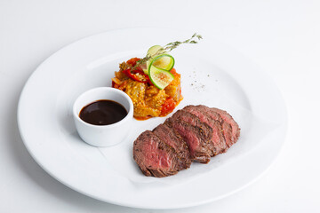 Sliced ​​barbecue meat with rice and red sauce