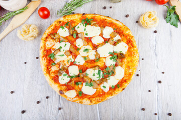 italian pizza on a wooden background with decoration around