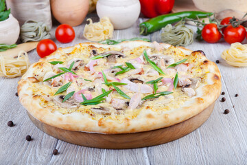 italian pizza on a wooden background with decoration around
