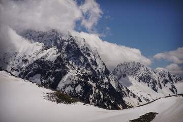 Sharp Peaks of Mountain Ridge under Snow. Close Up View