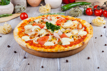 italian pizza on a wooden background with decoration around
