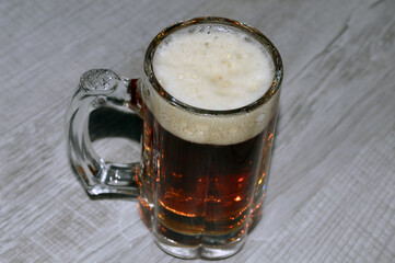 glass of beer on wooden table