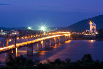 Naklejka na ściany i meble Pakse Bridge over the Mekong River at dusk.