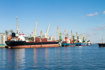 Naklejka premium sea ships loading tower cranes in port