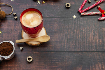 Coffee with milk on wooden background with christmas decoration