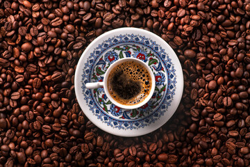 Arabic coffee cup with roasted beans