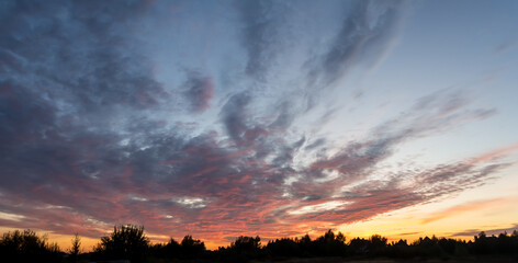 Evening sky with dramatic clouds over the sea. Dramatic sunset over the sea.