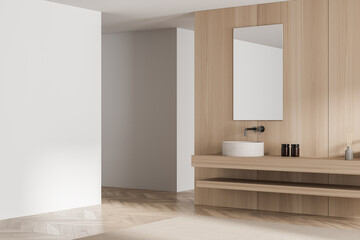 Wooden bathroom with modern floating vanity. Corner view.