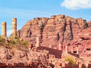 Fototapeta premium The Colonnaded Street in the ancient city of Petra, Jordan and a red rock mountain in the background