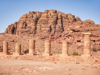 The Colonnaded Street in the ancient city of Petra, Jordan and a red rock mountain in the background