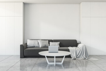 Grey sofa in white living room interior with coffee table, mockup
