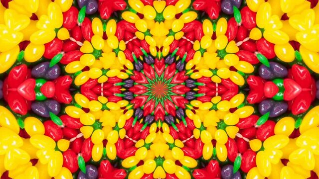 A kaleidoscopic futuristic wallpaper in vibrant green, yellow and red colors