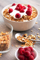 Sweet breakfast with granola, yogurt and fresh raspberries