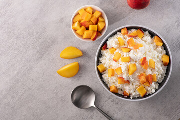 Fototapeta na wymiar Vitamin early breakfast of cottage cheese and fresh chopped peach