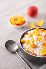 Vitamin early breakfast of cottage cheese and fresh chopped peach
