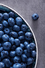 Closeup of fresh blueberry on a stone background