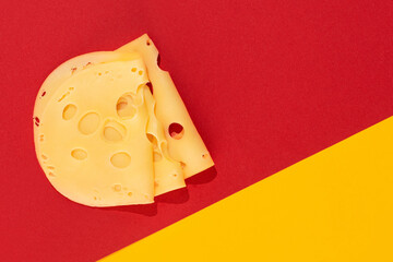 Sliced cheese on a yellow-red