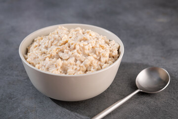 Delicious oatmeal without ingredients in a white bowl - 461973789