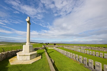 Cross of sacrifice and headstones at Kilchoman, Islay
