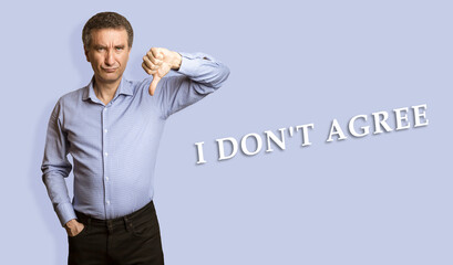 Frowning man showing negative feedback disapproval dislike sign.