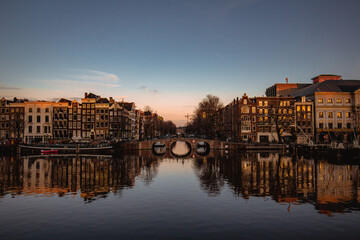 Obraz premium Amsterdam canal houses during sunset